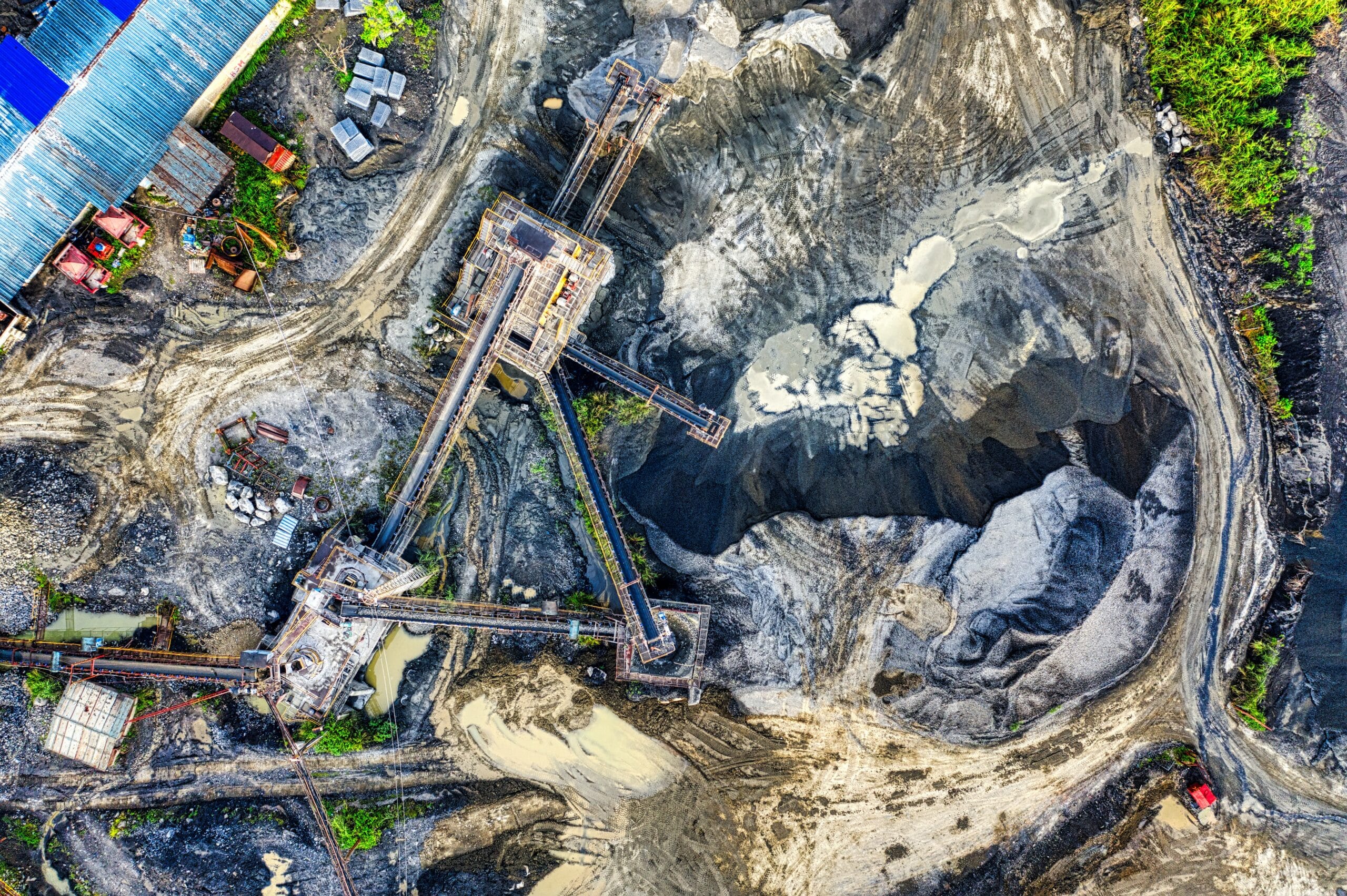 Panoramic View of a Mine with Mining Machines over Rocks